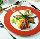 Lobster Au Gratin w/ wild rice cup and seasoned veggies